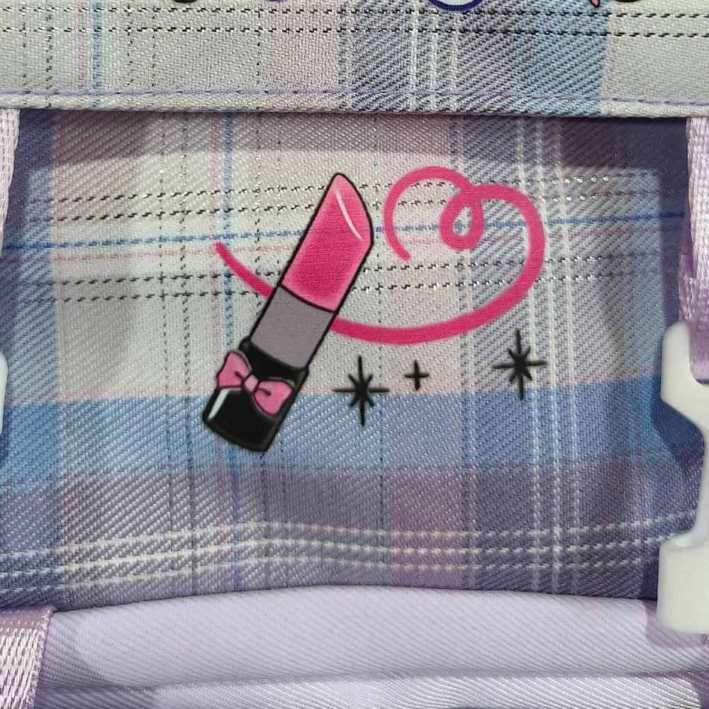 Multicolor heat-transfer artwork detail on a patterned backpack panel