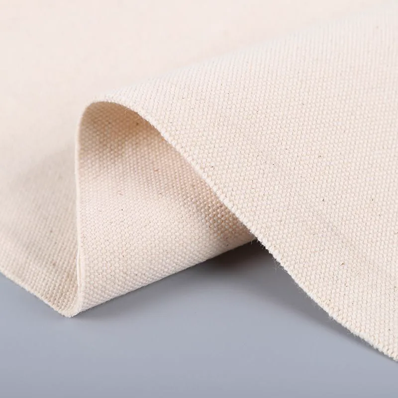 Natural canvas fabric folded to show its thickness and woven texture