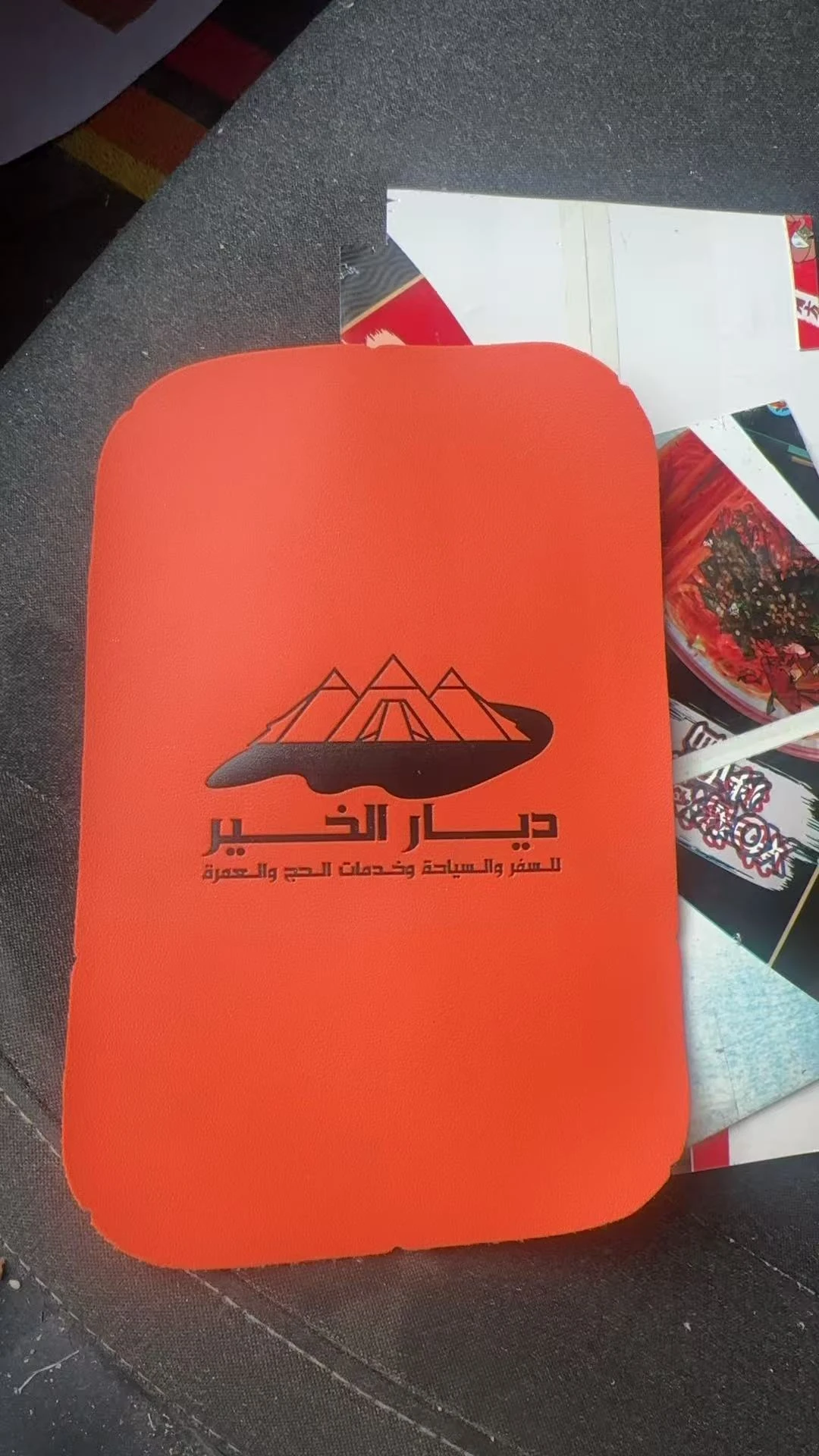 Orange bag panel with logo stamping effect for buyer approval