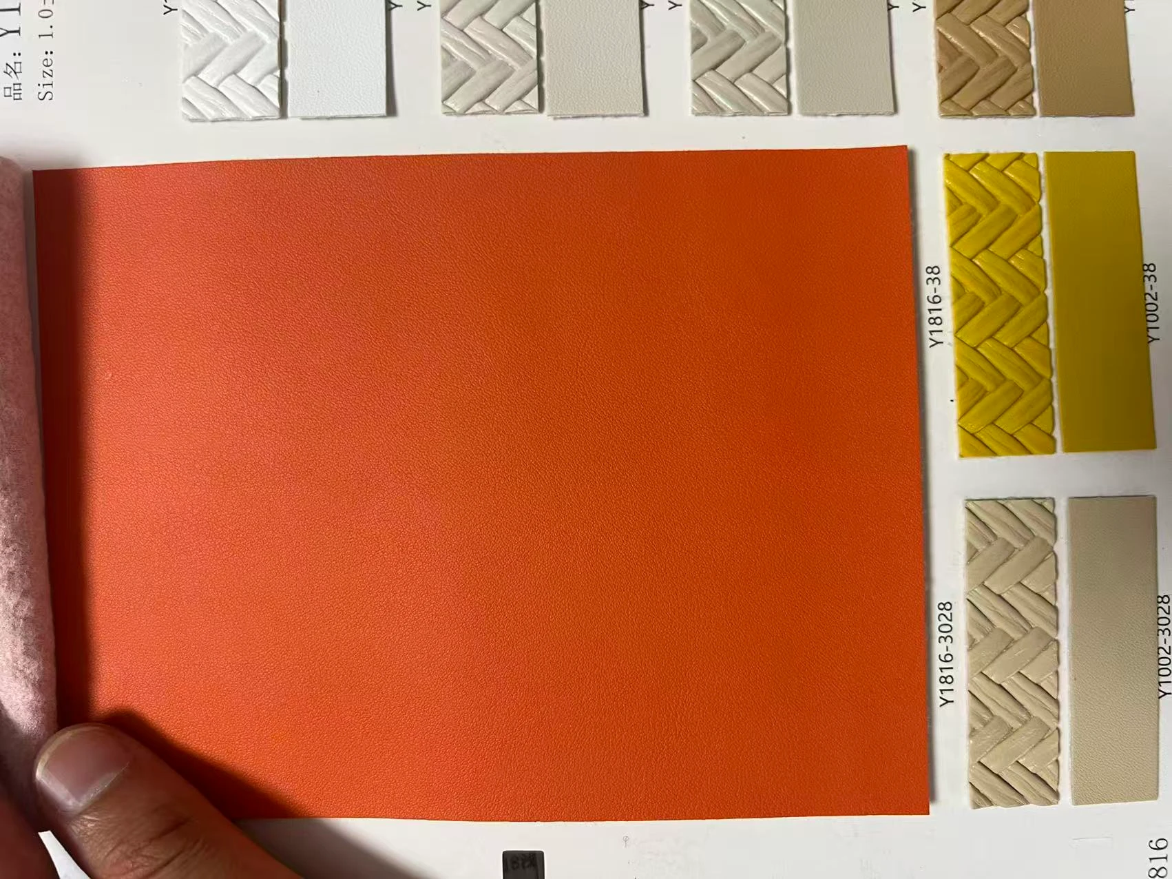 Orange PU leather color options reviewed before sample approval