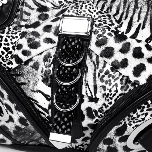 Close-up of decorative metal rings on a black animal print handbag
