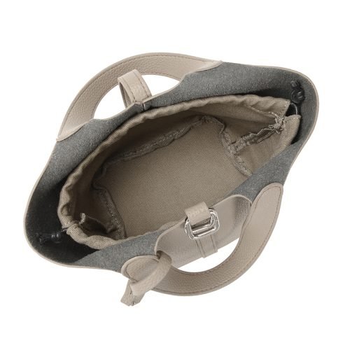 Top view into the open interior of a khaki bucket bag