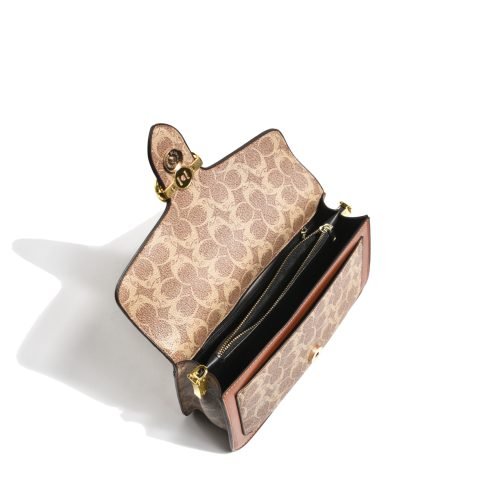 Open interior of a patterned flap shoulder bag