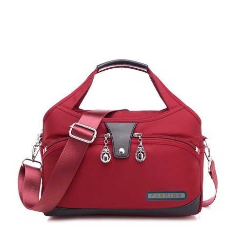 Red multi-pocket shoulder bag with adjustable strap