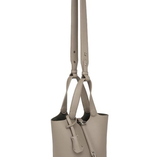 Side view of a khaki bucket bag showing strap hardware