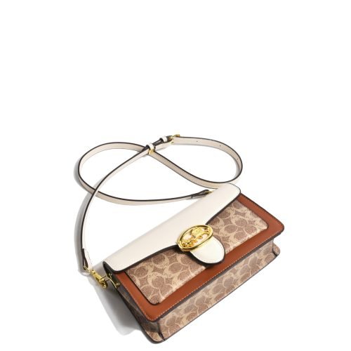 Angled view of a patterned flap shoulder bag