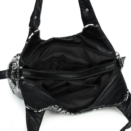 Open interior of a black animal print handbag