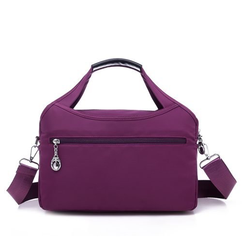 Back view of a purple multi-pocket shoulder bag with zipper pocket